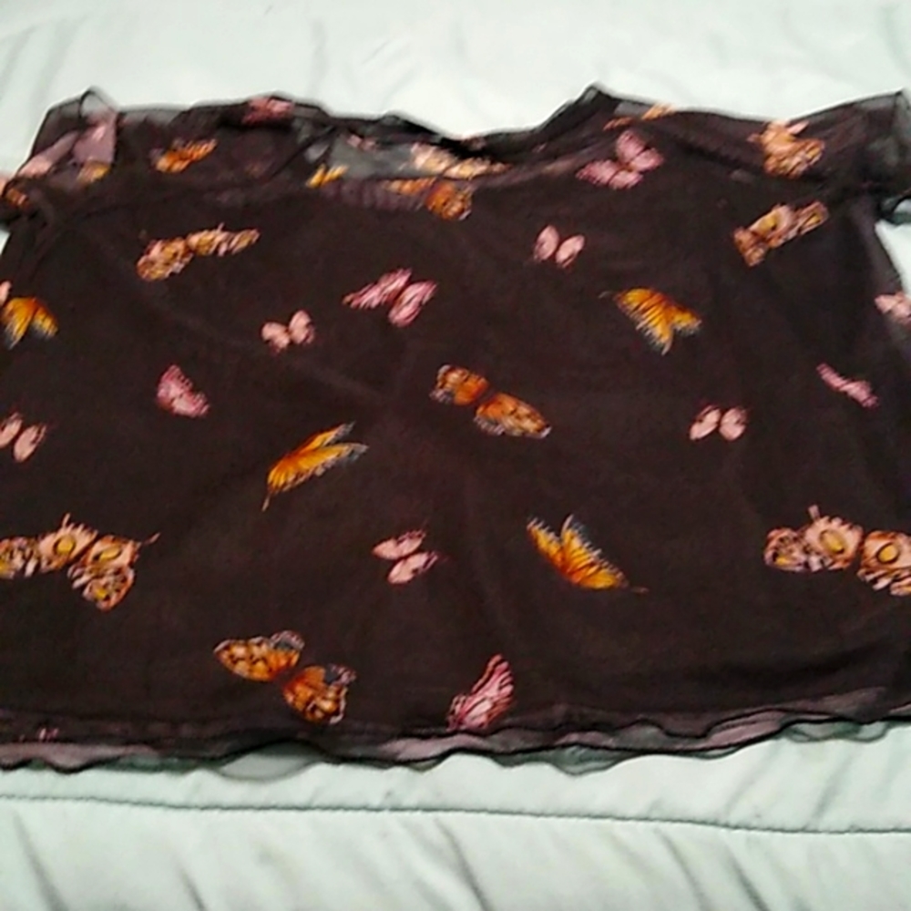 A black sheer shirt with butterflies